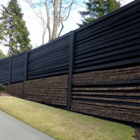 a black fence with slats on it